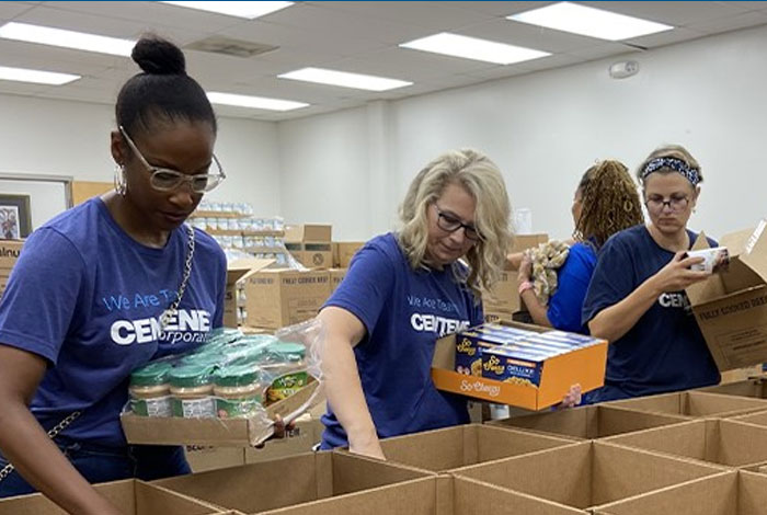 Centene volunteers packing food